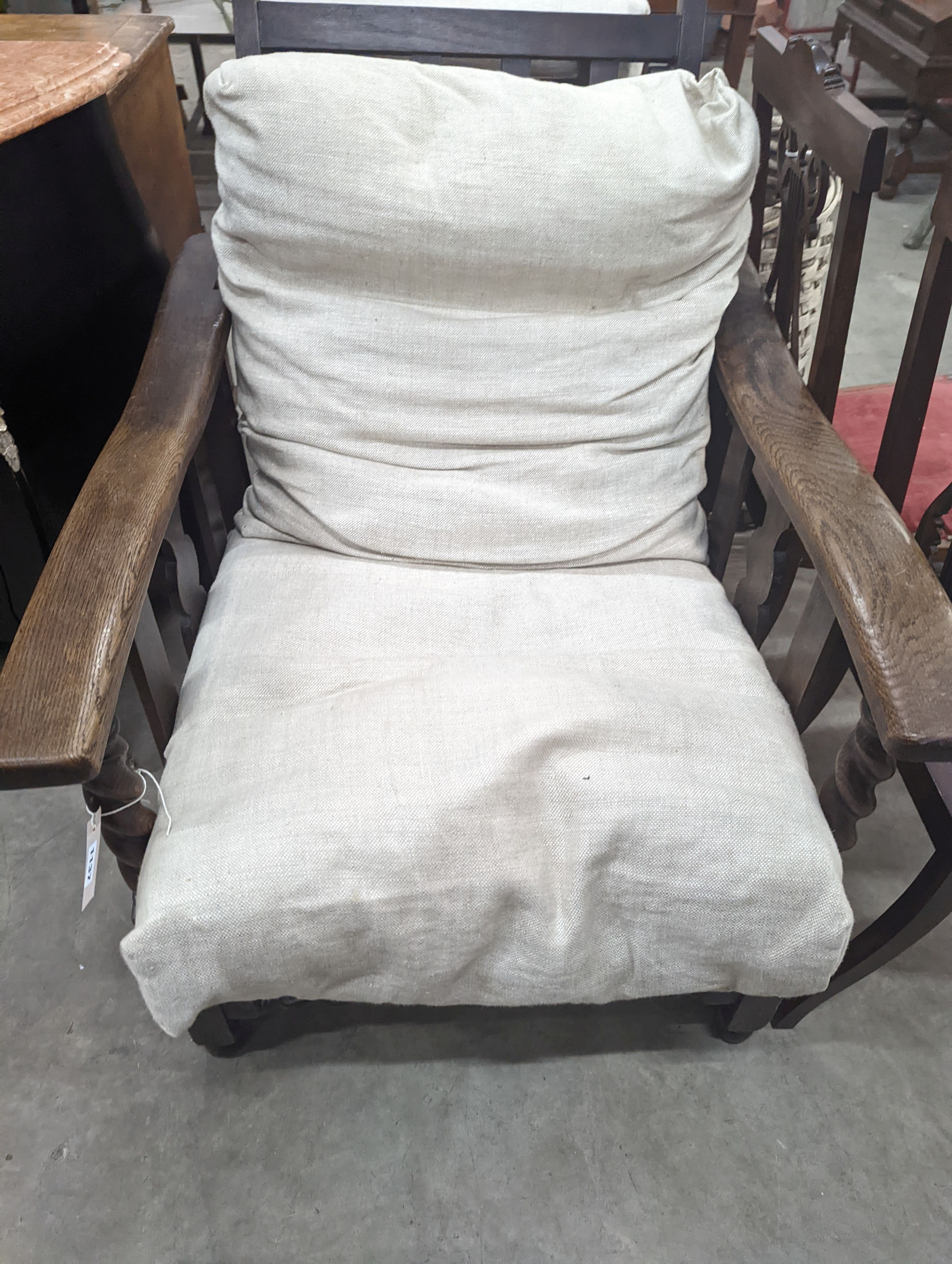 Two early 20th century oak reclining armchairs, larger width 73cm, depth 86cm, height 93cm